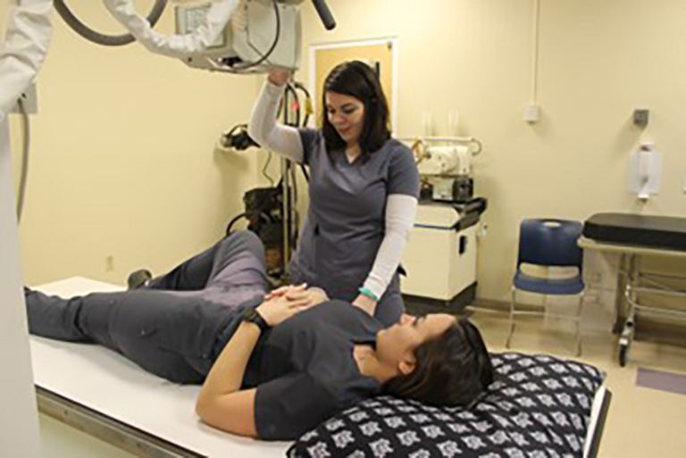 Image of Rad Tech students practicing skills in the clinical laboratory. 